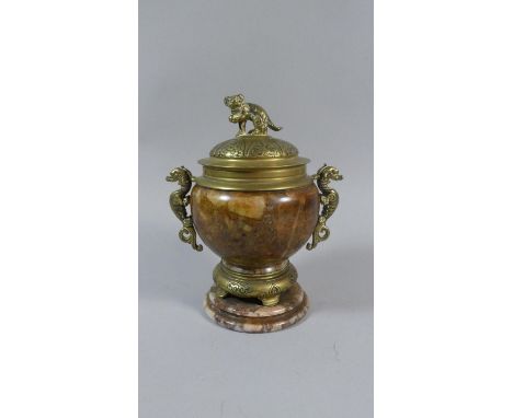 An Oriental Hardstone Lidded Vase with Ormolu Mounts and Base. Handles in the Form of Sea Horses. Finial to Lid as Temple Lio