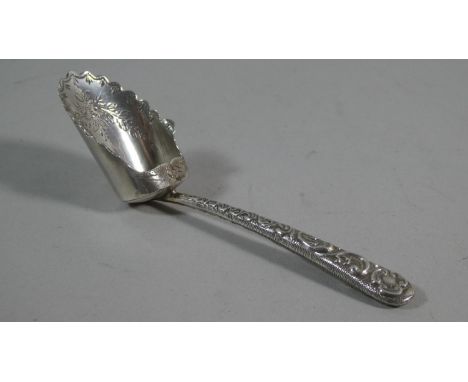 A Silver Caddy Spoon with Repousse Decoration to Handle and Etched Decoration to Scoop 