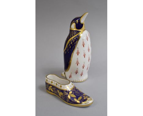 A Royal Crown Derby Penguin Paperweight, Gold Button, Together with a Spode Blue and Gilt Shoe.