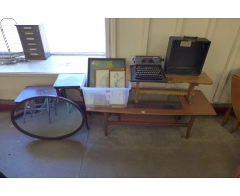 A vintage Everest typewriter, simulated teak coffee table, three other tables, prints and mirror