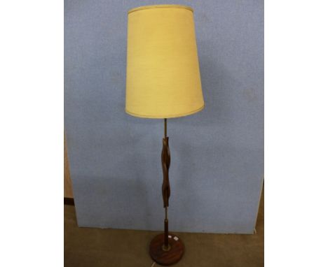 A teak standard lamp