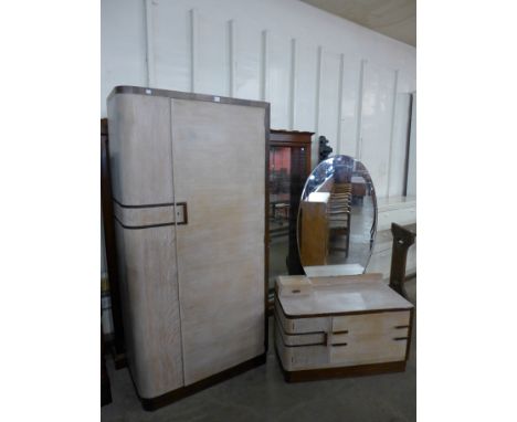 An Art Deco limed oak two piece bedroom suite
