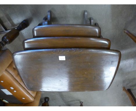 An Ercol oak nest of tables