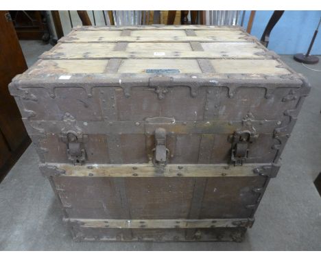 A 19th Century pine and cast iron clad ship's chest by C.A. Taylor Trunk Works Chicago & New York
