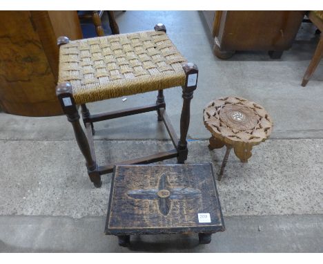 A Victorian carved oak stool, another oak stool and small Indian carved wood table