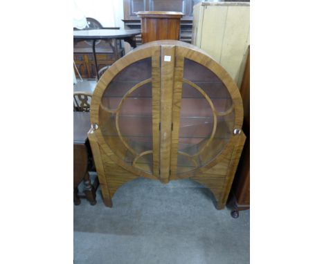 An Art Deco walnut circular display cabinet