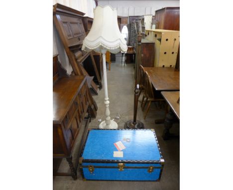 Two standard lamps and a steamer trunk