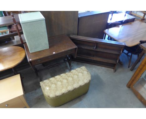 A walnut sofa table, two wicker ottomans and an Ercol plate rack