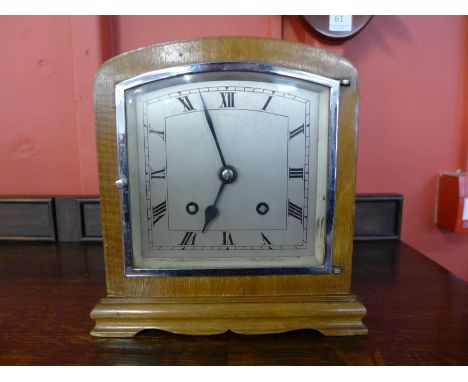 An Art Deco walnut mantel clock, with Empire striking movement