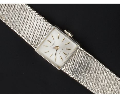 A LADY'S 9CT WHITE GOLD BRACELET WATCH BY TISSOT, the square silvered dial with baton markers, to manual wind movement, polis
