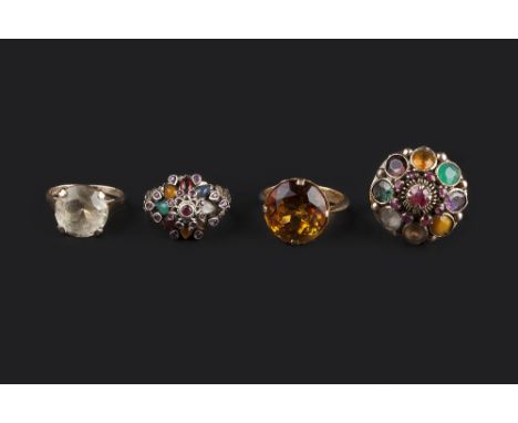 FOUR GEM SET DRESS RINGS, comprising two vari gem-set tiered cluster rings, each stamped '14k', a circular citrine single sto