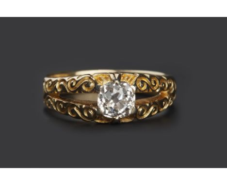 A DIAMOND SINGLE STONE RING, the cushion-shaped old-cut diamond claw set to  a bifurcated mount, with scroll engraved shoulde