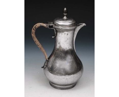 A LATE GEORGE II SILVER BALUSTER SHAPED COFFEE POT standing on a turned foot, domed hinged lid with flame finial and with a c
