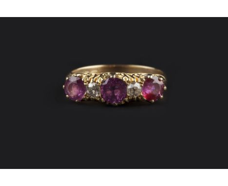 A RUBY AND DIAMOND HALF HOOP RING, set with a trio of circular mixed-cut rubies, spaced by old-cut diamonds, to a scroll pier
