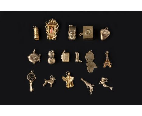 A COLLECTION OF CHARMS, comprising various 9ct gold and yellow metal examples, to include a lantern, with coral corallium rub