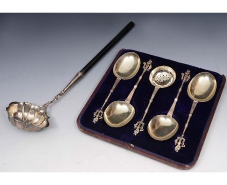 A GEORGE II SILVER PUNCH LADLE with shaped bowl and turned ebonised handle, 34cm long, London 1755; a cased set of four silve