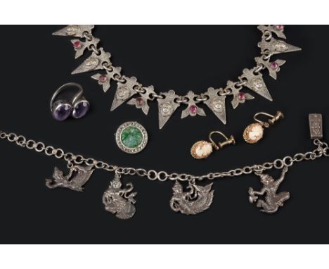 A SMALL COLLECTION OF JEWELLERY, comprising an amethyst and rock crystal three stone brooch, with flowerhead highlights, an a