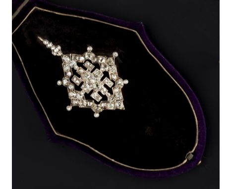 A VICTORIAN DIAMOND SET PENDANT/BROOCH, the openwork lozenge-shaped panel centred with a cluster of cushion-shaped old-cut di