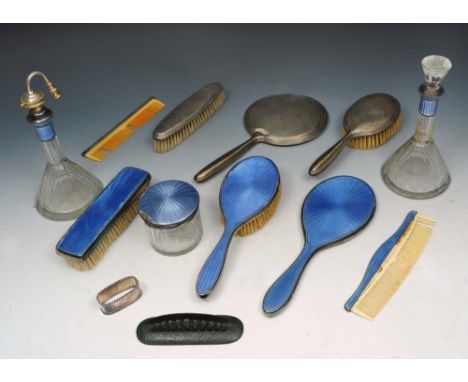 A GERMAN BLUE ENAMELLED DRESSING TABLE SET TO INCLUDE: a hand mirror, hairbrush, clothes brush, comb, silver topped glass jar