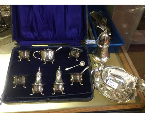A SILVER SEVEN PIECE CRUET SET CONSISTING OF four salts with blue glass liners, a mustard pot with a glass liner, two peppers