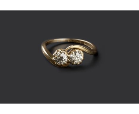 A DIAMOND TWO STONE CROSSOVER RING, the old brilliant-cut diamonds in claw setting, 18ct gold mounted, maker's mark 'A.M.B', 