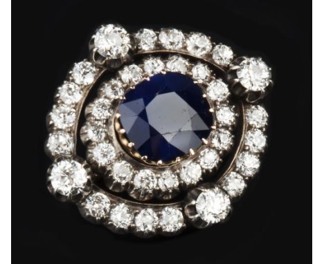 A LATE 19TH/EARLY 20TH CENTURY SAPPHIRE AND DIAMOND BROOCH, the cushion-shaped mixed-cut sapphire measuring approximately 11m