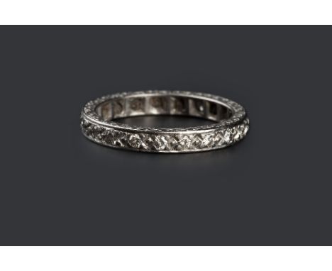 A DIAMOND FULL HOOP RING, set throughout with round brilliant-cut diamonds, the 18ct white gold mount with scroll engraved de