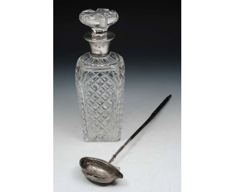 A GEORGIAN SILVER MOUNTED PUNCH LADLE with a bead decorated pear shaped bowl and with a twisted whale bone handle, 38cm long;