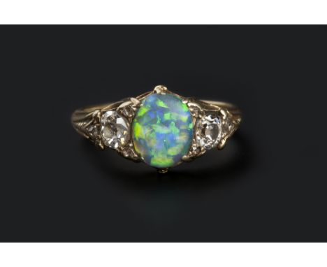 AN OPAL AND DIAMOND DRESS RING, the oval cabochon opal claw set between two cushion-shaped diamonds, with rose-cut diamond po