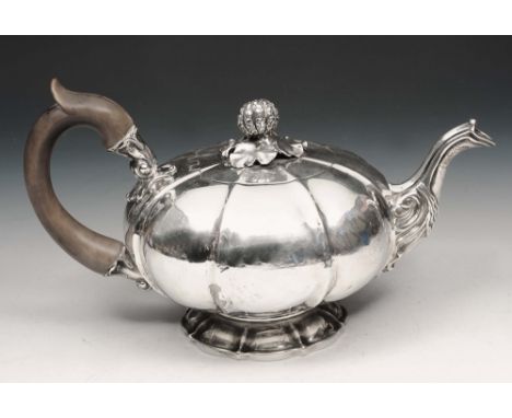 A GEORGE IV SILVER TEAPOT, gourd shaped pot with matching foot, lid with a cast fruit shaped finial and wooden handle, 16.5cm