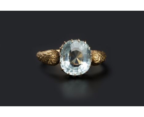 A RUSSIAN AQUAMARINE SINGLE STONE RING, the cushion-shaped mixed-cut aquamarine in claw setting, between bulbous shoulders of