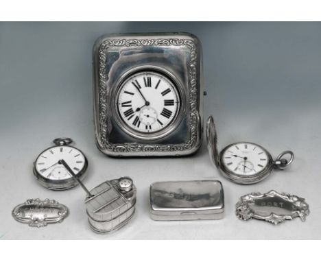 A SILVER MOUNTED WATCH STAND with pressed scroll decoration and with a plated pocket watch, 12cm high; two further silver poc