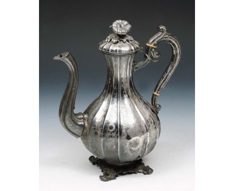 A CONTINENTAL COFFEE POT, baluster shaped with engraved fluting, cast scrolling base, matching lid with foliate finial, beari