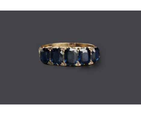A SAPPHIRE FIVE STONE RING, the graduated cushion-shaped mixed-cut sapphires spaced by rose-cut diamonds points, to a scroll 
