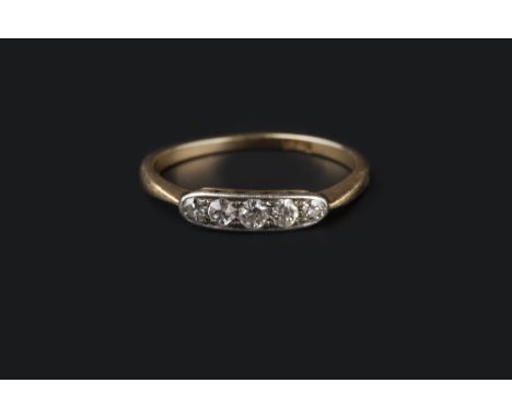 A DIAMOND FIVE STONE RING, the elongated oval panel inset with graduated old-cut diamonds, two colour precious metal mounted,