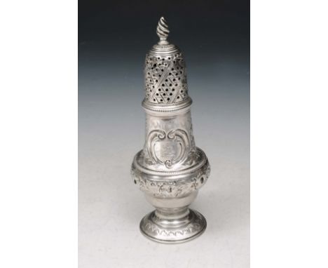 A GEORGE III SILVER CASTOR, baluster shaped with chased foliate decoration and with a drilled and engraved lid and flame fini