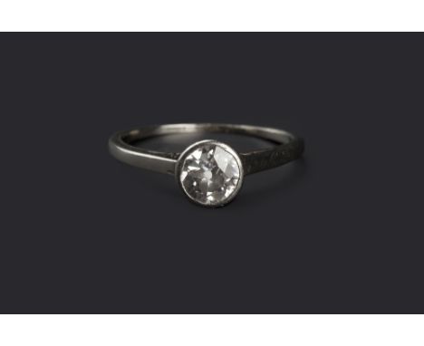 A DIAMOND SINGLE STONE RING, the old brilliant-cut diamond in millegrain collet setting, to shank stamped '18ct plat', diamon