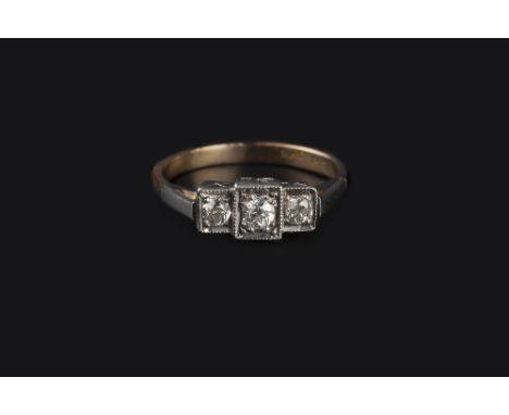 A DIAMOND THREE STONE RING, the old brilliant-cut diamonds in millegrain square settings, two colour precious metal mounted, 