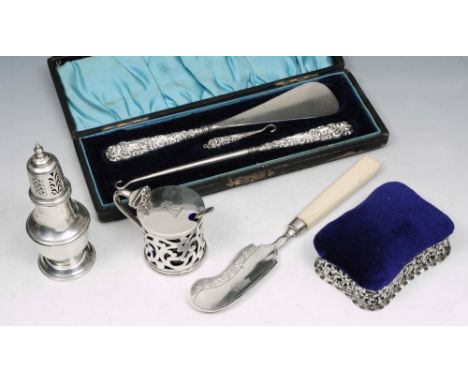 A VICTORIAN SILVER RECTANGULAR SHAPED PIN CUSHION with pierced foliate sides by Synyer & Beddoes, 18cm wide; a silver mustard
