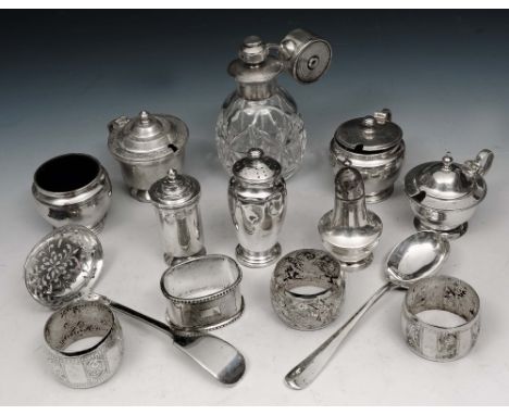 A QUANTITY OF SILVER TO INCLUDE: three peppers, two mustard pots, a salt with glass liners, a further mustard pot, sifter spo