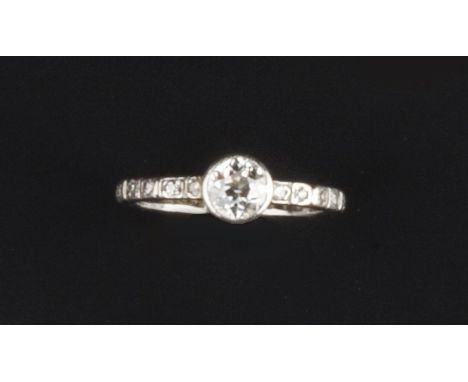 A DIAMOND SINGLE STONE RING, the old brilliant-cut diamond in collet setting, to a panelled shank set throughout with single-