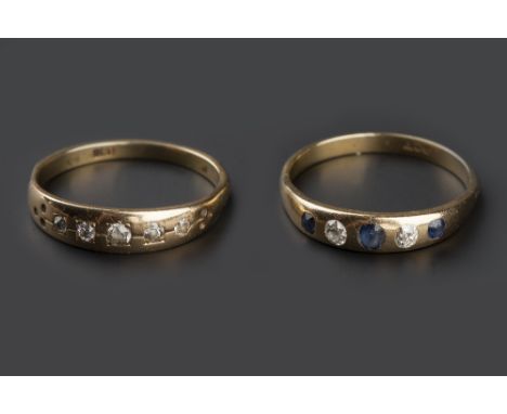 TWO DIAMOND SET FIVE STONE RINGS, the first alternately set with graduated old-cut diamonds and cushion-shaped sapphires, the