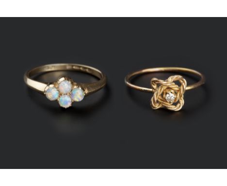 TWO GEM SET DRESS RINGS, the first set with a quatrefoil-shaped cluster of cabochon opals, 18ct gold mounted, the second of r