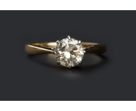 A DIAMOND SINGLE STONE RING, the round brilliant-cut diamond in eight-claw setting, two colour precious metal mounted, stampe