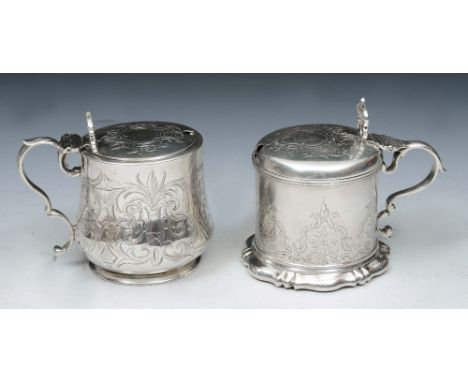 A VICTORIAN SILVER MUSTARD POT with a shaped base, foliate engraved sides, domed hinged lid and blue glass liner, 9cm high, L