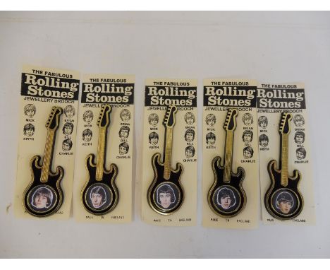 A rare set of Rolling Stones guitar shaped brooch badges to include Brian Jones.