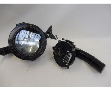 A portable signalling lantern and one other lamp.