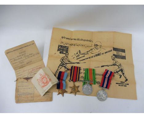 A group of WWII medals awarded to Harold Bindon with grade card etc. plus a swagger stick.