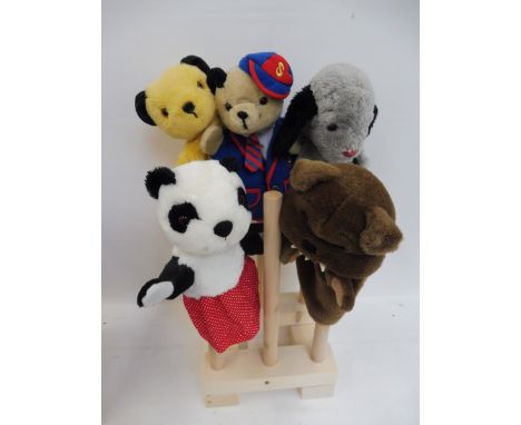 Five hand puppets including Sooty and Sweep, approximately 1960s. 