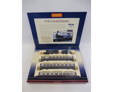 A boxed Hornby train pack - The Caledonian, comprising engine tender and three coaches, DCC shop fitted, limited edition with